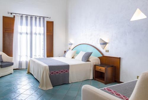 Ένα ή περισσότερα κρεβάτια σε δωμάτιο στο Hotel la Torre