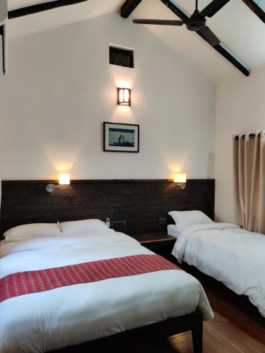 Postelja oz. postelje v sobi nastanitve Bardia Forest Resort