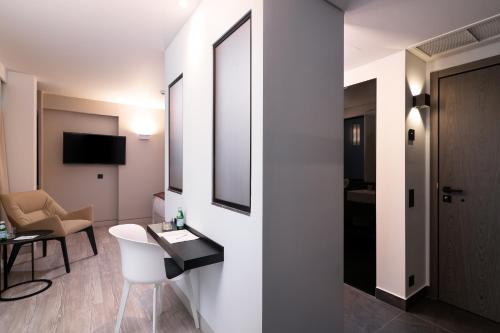 a hotel room with a bathroom with a mirror at S Hotel Boutique Thessaloniki in Thessaloniki