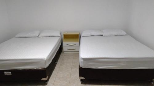 Cama o camas de una habitación en Casa aconchegante Mariscal