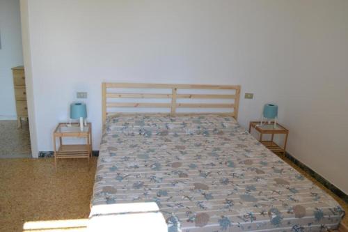 Кровать или кровати в номере Appartamento 10