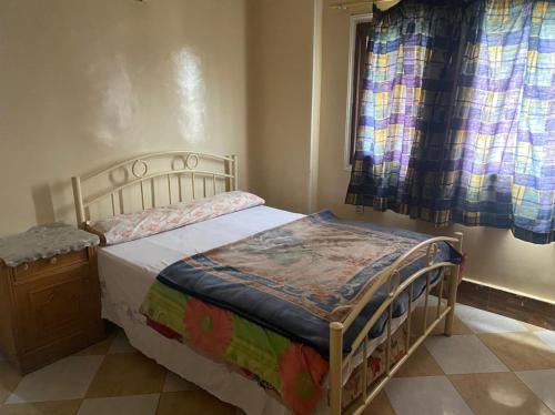 En eller flere senge i et værelse på Elredy's Apartment Super Luxe Edition