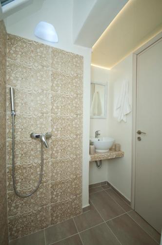 a bathroom with a shower and a sink at Mykonos Marina in Mikonos
