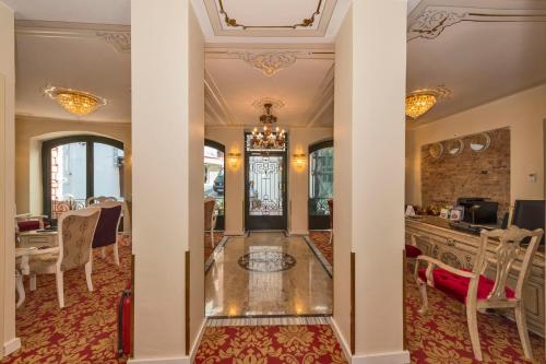 a view of a dining room with a table and chairs at Galatower Hotel in Istanbul