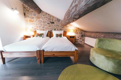 Postel nebo postele na pokoji v ubytování Gîte de Beauregard - Les Fermes Ardéchoises