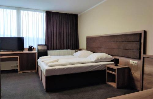 Postel nebo postele na pokoji v ubytování Hotel Cargo