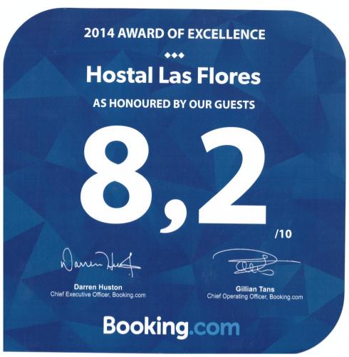 a poster for a hospital las flores with the number at Hostal Las Flores Ramblas in Barcelona