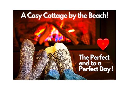 a persons feet in socks in front of a fireplace at Romantic Lakeside Cottage by the Beach! with Super Cosy Log Burner! The Perfect Escape to Your Home from Home by the Sea! So Relaxing - You Won't want to Leave! Pet Friendly! in Mablethorpe