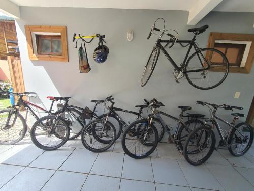 a bunch of bikes are lined up against a wall at Morada Vó Rita in Florianópolis