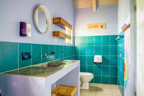a bathroom with a sink and a toilet at Selina Playa Venao in Playa Venao