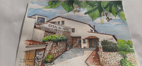 a drawing of a building in a book at Casal da Serra in Penha Garcia
