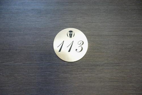 a white button with the number on it at Verdisso Hotel & Restaurant in Demir Kapija