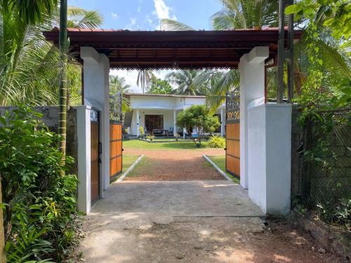 an entrance to a house with a gate at Villa Alex in Beruwala