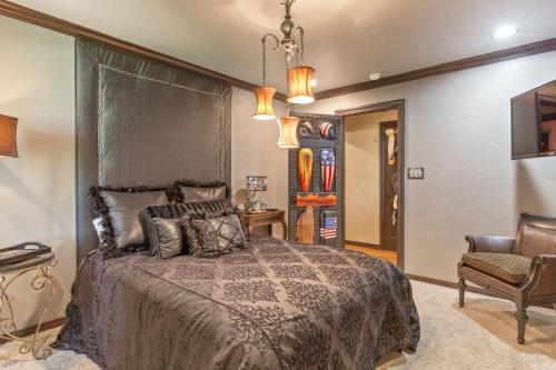 a bedroom with a bed and a chair at The Funky Monkey Inn in Afton