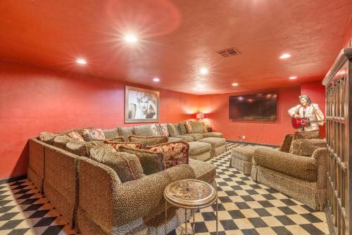 a living room with a couch and chairs and a tv at The Funky Monkey Inn in Afton