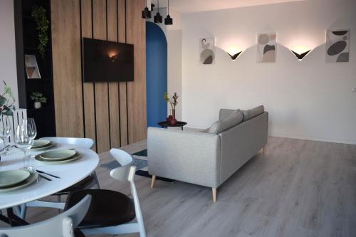 a living room with a couch and a table at Veles Apartments in Sibiu