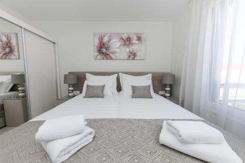 Ένα ή περισσότερα κρεβάτια σε δωμάτιο στο Villa Dora