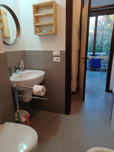 a bathroom with a sink and a toilet at Da Ramona in Iseo
