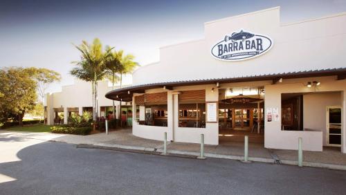 a shopping center with a sign on the front of it at Nightcap at Springwood Hotel in Springwood