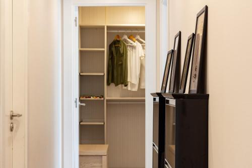 a walk in closet with a door open at AH El Rincón del Condado VUT2805AS in Noreña