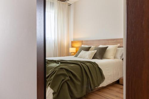 Llit o llits en una habitació de El Rincón del Condado by Asturias Holidays