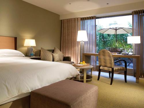 Кровать или кровати в номере City Suites-Taipei Nanxi