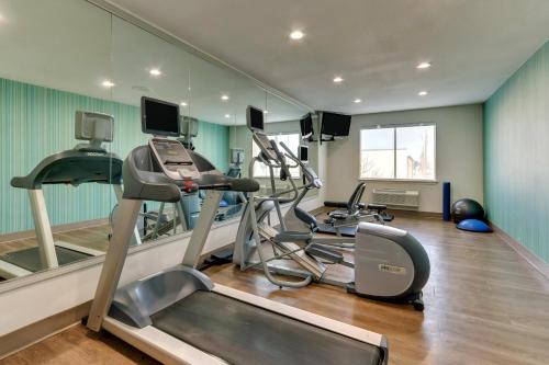 a gym with two tread machines and a treadmill at Holiday Inn Express Lake Worth NW Loop 820 by IHG in Fort Worth