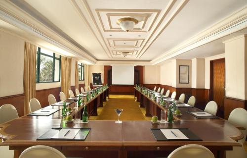 a large conference room with a long table and chairs at Melia Purosani Yogyakarta in Yogyakarta