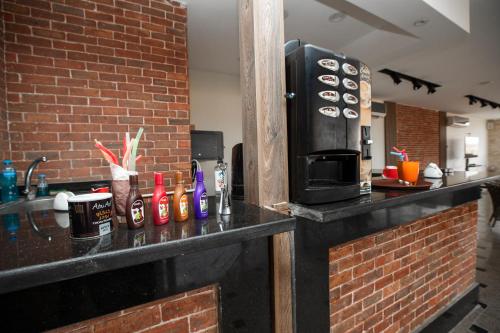 a kitchen with a counter top with a microwave at Brothers Pyramids View in Cairo