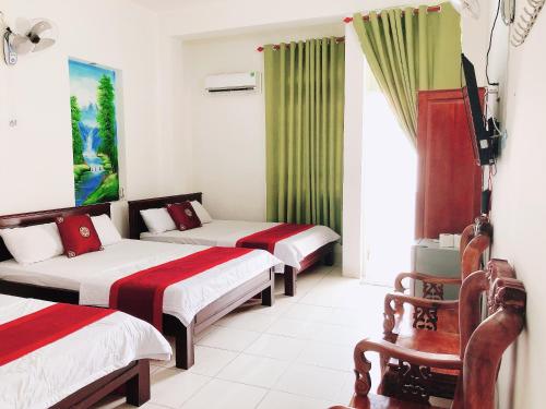 Postel nebo postele na pokoji v ubytování Đức Trọng Hotel