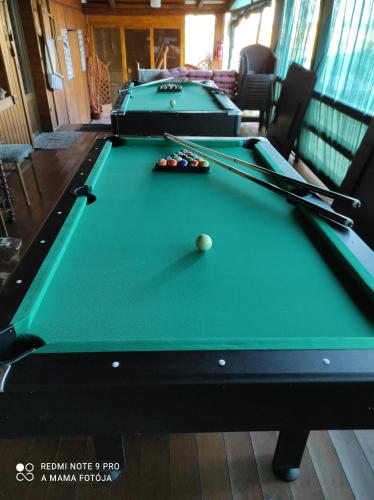 two pool tables in a living room with sidx sidx sidx at Gemenc Vendégház in Hercegszántó