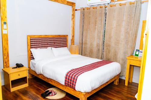 Postel nebo postele na pokoji v ubytování Silu Homes by Hostmandu