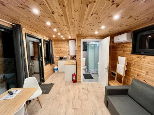 a living room and kitchen of a tiny house at Pixel - Tiny Campus in Tîrgu Secuiesc