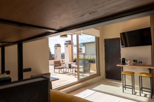 a living room with a view of a patio at Domus Aurelia in Rome
