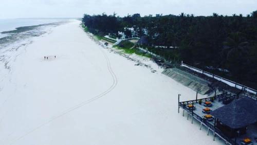 an aerial view of a beach with the ocean at Kilifi Bay Beach Resort in Kilifi