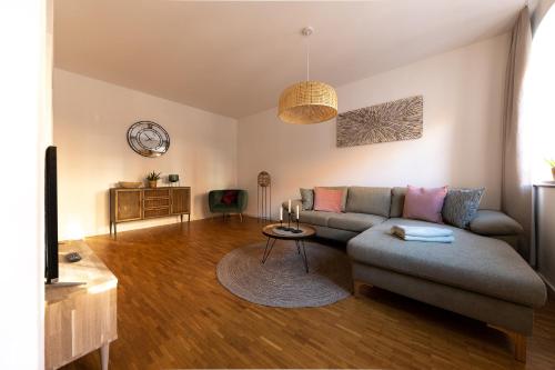 a living room with a couch and a table at Pension Donatus in Pirna
