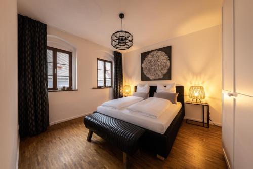 a bedroom with a king sized bed and a window at Pension Donatus in Pirna