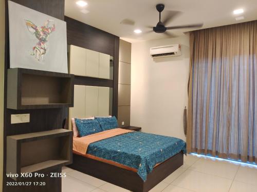 a bedroom with a bed and a ceiling fan at Sky Garden Penthouses in Chemor
