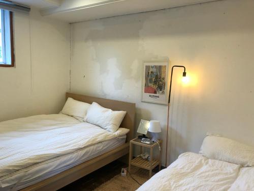 Ένα ή περισσότερα κρεβάτια σε δωμάτιο στο Hostel Seoul
