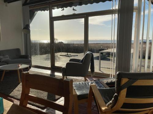 a living room with a large window with a view at BBL59 in Fåborg