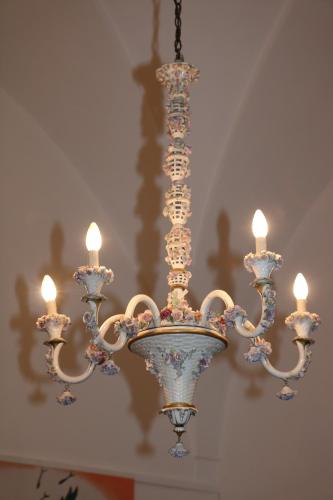 a chandelier with candles hanging from a ceiling at B&B Il Giardino di Paola in Alliste