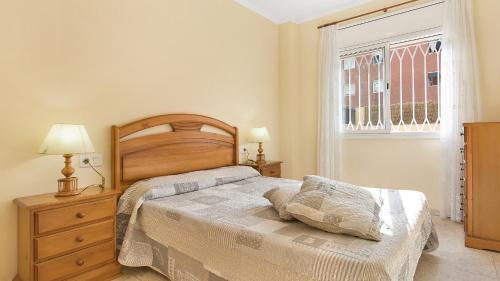 a bedroom with a bed and a window at 2P-53 - Lloret de Mar in Lloret de Mar