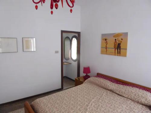 Posteľ alebo postele v izbe v ubytovaní A due passi dall'antico Ghetto, sestiere di Cannaregio