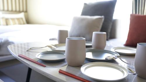 a table with plates and chargers on top of it at fav ISE in Ise