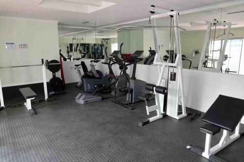 a gym with treadmills and exercise equipment in it at Whales & Waves in Hermanus