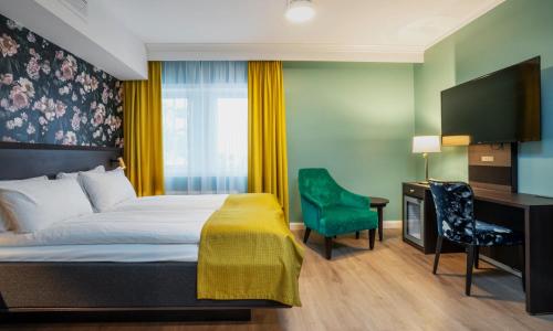 Ένα ή περισσότερα κρεβάτια σε δωμάτιο στο Thon Hotel Høyers