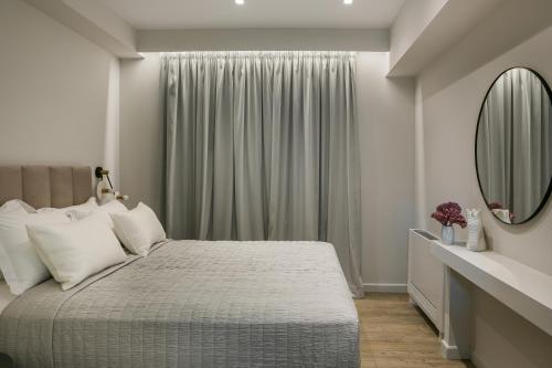 Ένα ή περισσότερα κρεβάτια σε δωμάτιο στο The Twelve Suites Collection