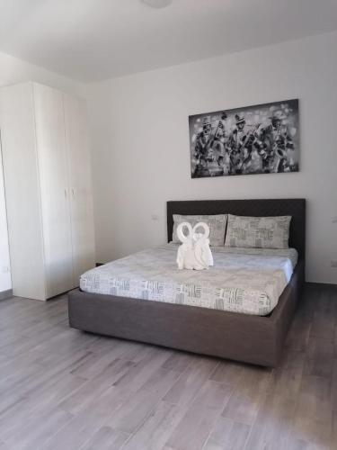 Ένα ή περισσότερα κρεβάτια σε δωμάτιο στο SGC Boa Vista Apartments