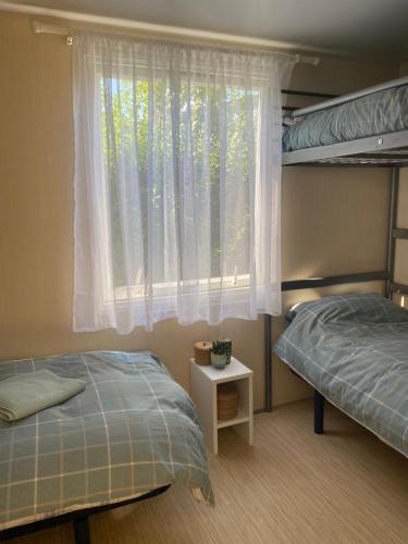 Postel nebo postele na pokoji v ubytování Driftwood