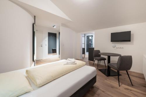 Televízia a/alebo spoločenská miestnosť v ubytovaní Appartements zur Sonne